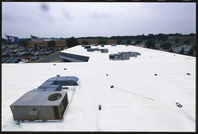 White reflective roof on a retail building with rooftop HVAC units